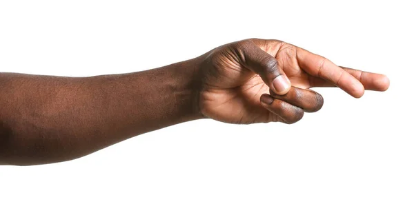 Hand of African-American man with crossed fingers on white background — Stock Photo, Image