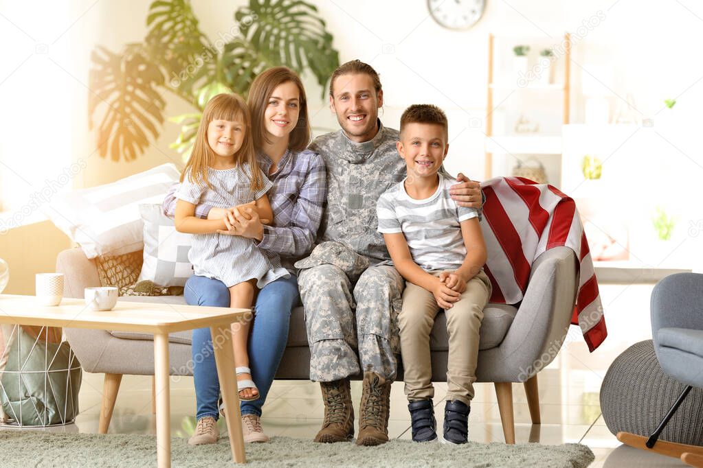 Happy military man with his family at home