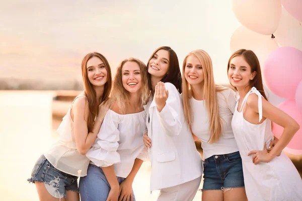 Beautiful young women at hen party near river — Stock Photo, Image