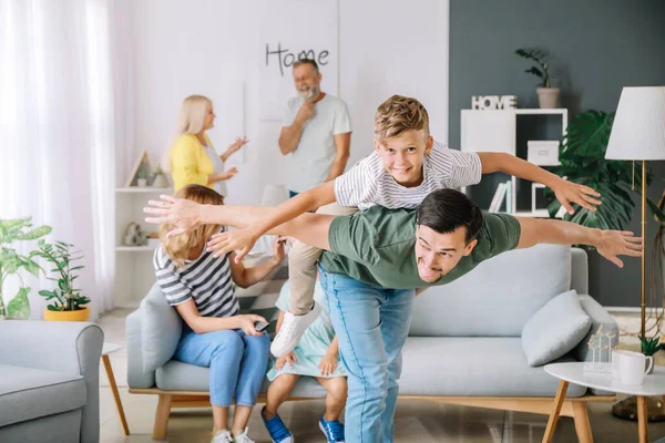 Happy father with little son having fun at home — Stock Photo, Image