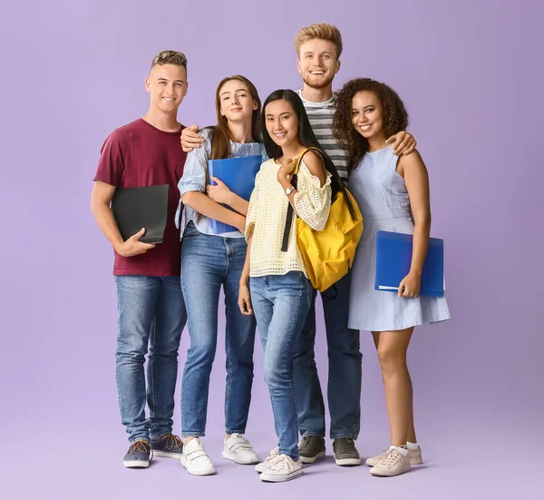 Group of students on color background — Stock Photo, Image