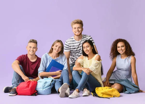 Group of students on color background — Stock Photo, Image