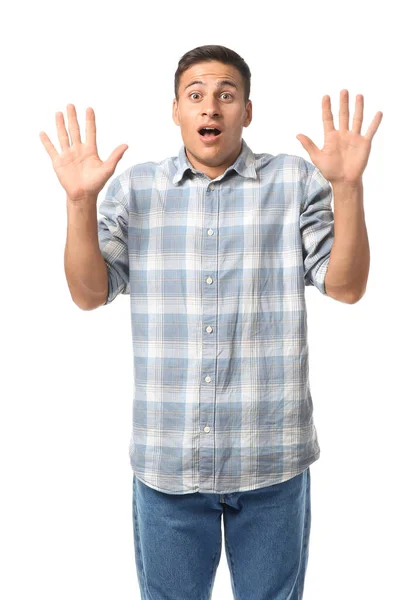 Portrait of shocked young man on white background — Stock Photo, Image