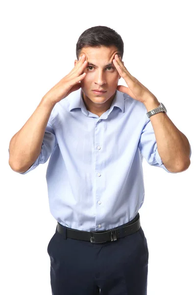 Portrait of handsome young businessman suffering from headache on white background — Stock Photo, Image