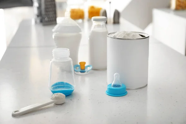 Baby milk formula on table in kitchen — Stock Photo, Image