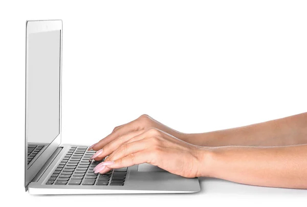 Young woman working on laptop against white background — Stock Photo, Image