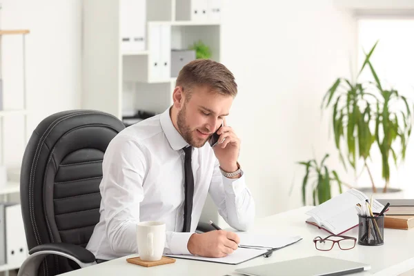 Handsome businessman working in office — Stock Photo, Image