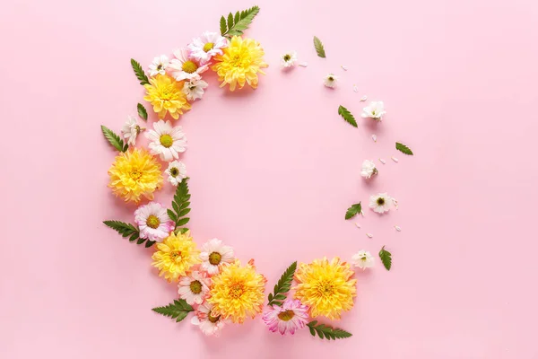 Frame made of beautiful flowers on color background — Stock Photo, Image