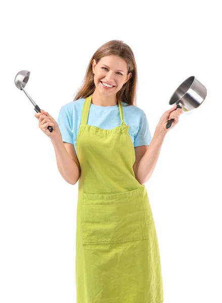 Mulher bonita com utensílios de cozinha no fundo branco — Fotografia de Stock