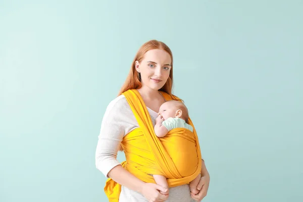 Mother with cute baby on color background — Stock Photo, Image