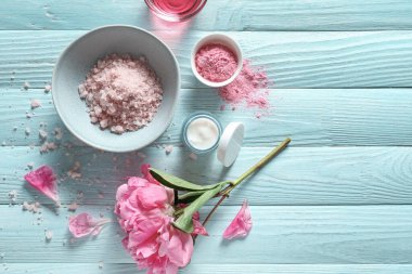 Composition with cosmetics for spa procedures on wooden background