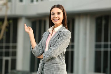 Portrait of beautiful young businesswoman outdoors