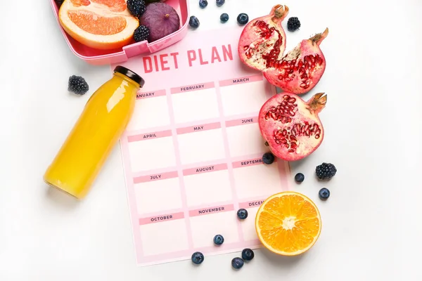 Sheet of paper with diet plan, bottle of juice and fresh fruits on white background — Stock Photo, Image