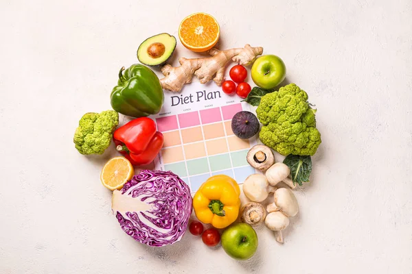 Sheet of paper with diet plan and healthy products on light background — Stock Photo, Image
