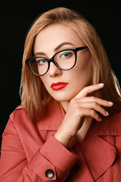 Portrait of beautiful young woman on dark background — Stock Photo, Image