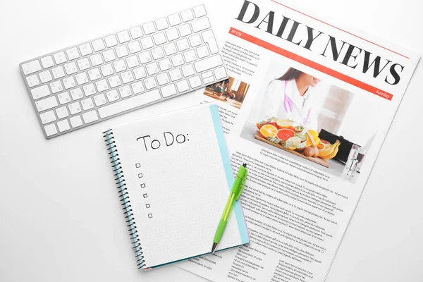 Empty to do list, newspaper, pen and PC keyboard on white background — Stok fotoğraf