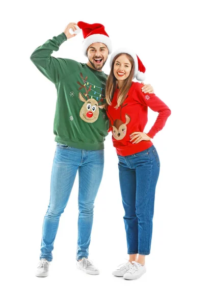 Happy young couple in Christmas clothes on white background — Stock Photo, Image