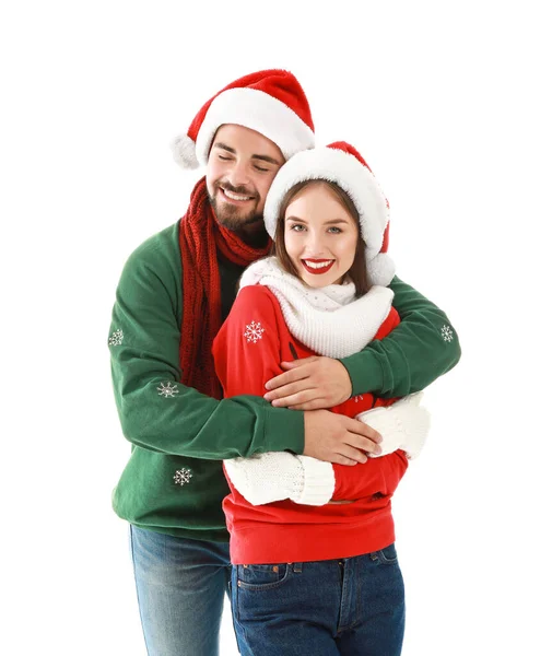 Feliz jovem casal em roupas de Natal no fundo branco — Fotografia de Stock