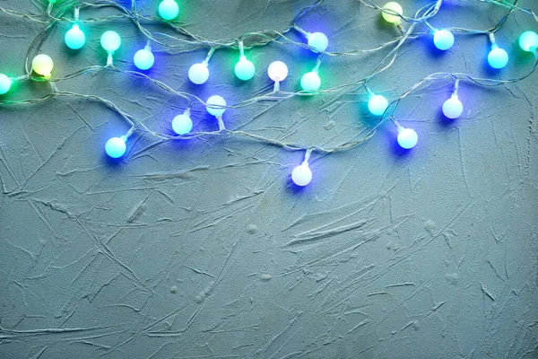 Beautiful glowing garland on grey background — Stock Photo, Image