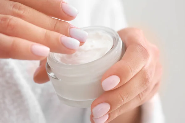 Woman with jar of cosmetic cream, closeup — Stock Photo, Image