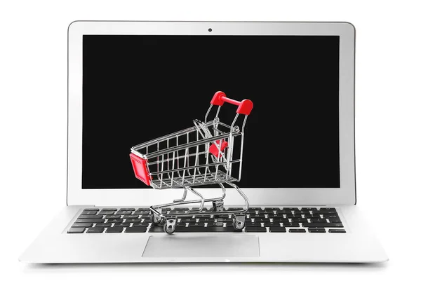 Laptop and small cart on white background. Internet shopping concept — Stock Photo, Image