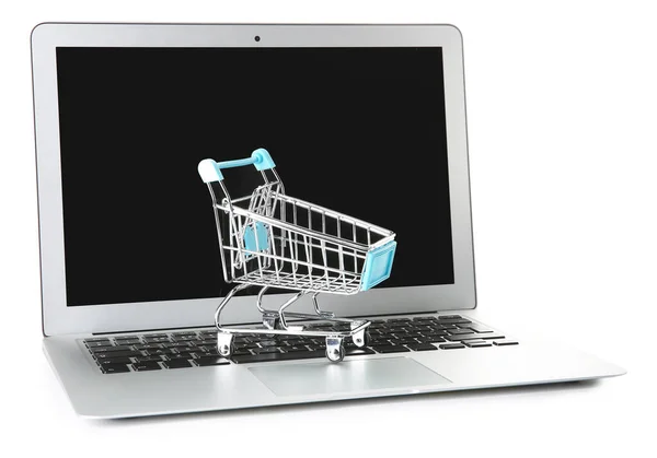 Laptop and small cart on white background. Internet shopping concept — Stock Photo, Image