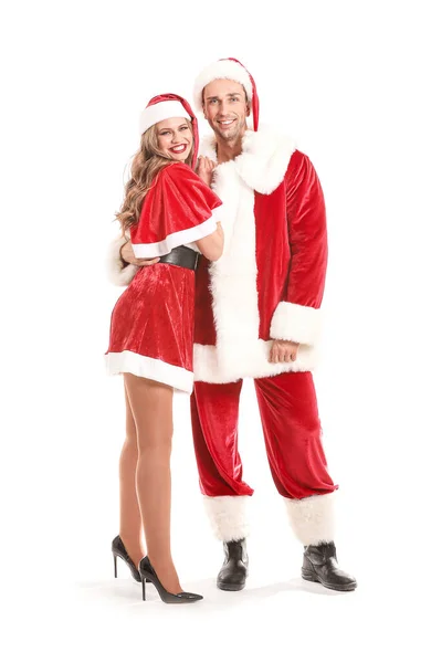 Młoda para przebrana za Świętego Mikołaja na białym tle — Zdjęcie stockowe