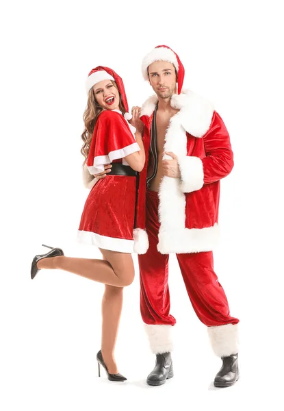 Young couple dressed as Santa Claus on white background — ストック写真