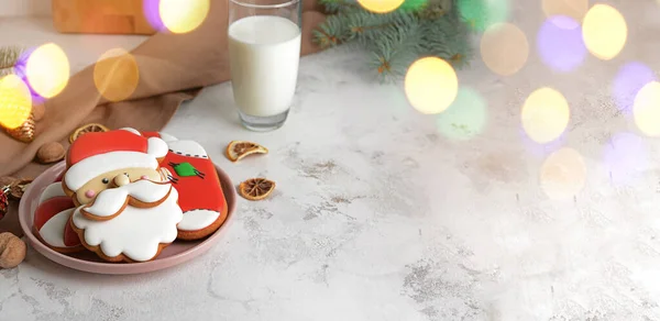 Plate with tasty Christmas cookies and glass of milk on table — Stock Photo, Image