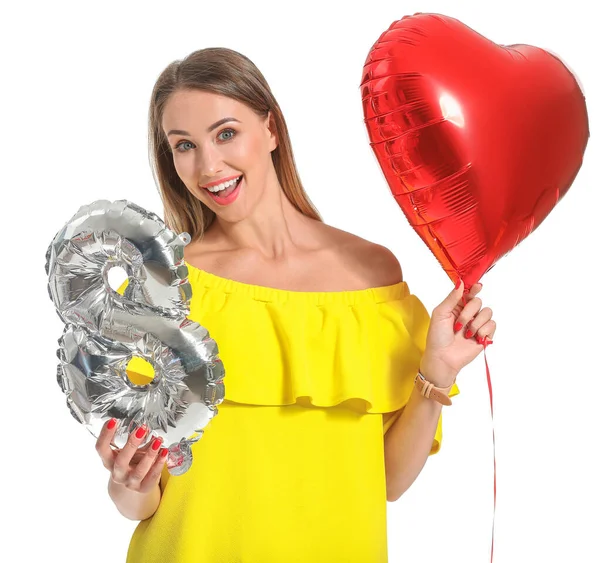 Beautiful young woman with air balloon and figure 8 on white background. International Women's Day celebration — Stock Photo, Image