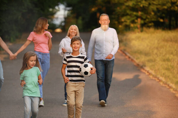 Big family walking in park