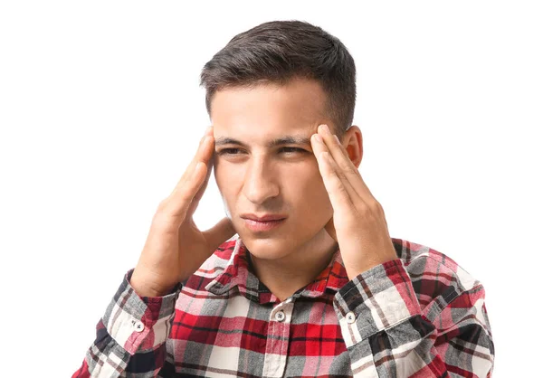 Portrait of handsome young man suffering from headache on white background — Stok fotoğraf