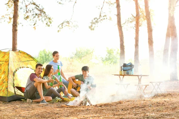 Young friends spending weekend in forest — Stock Photo, Image