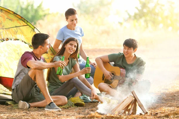 Young friends spending weekend in forest — Stock Photo, Image
