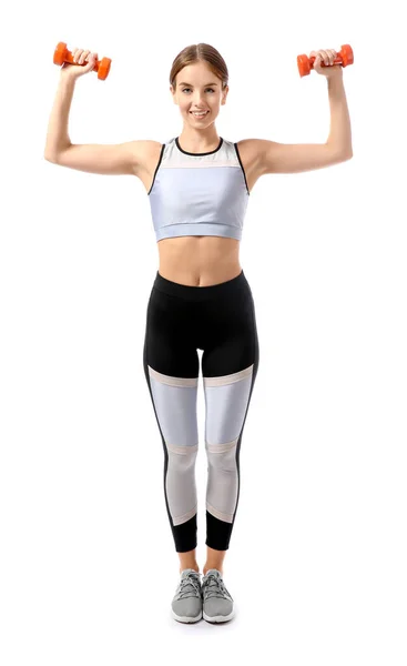 Sporty young woman training with dumbbells against white background — ストック写真