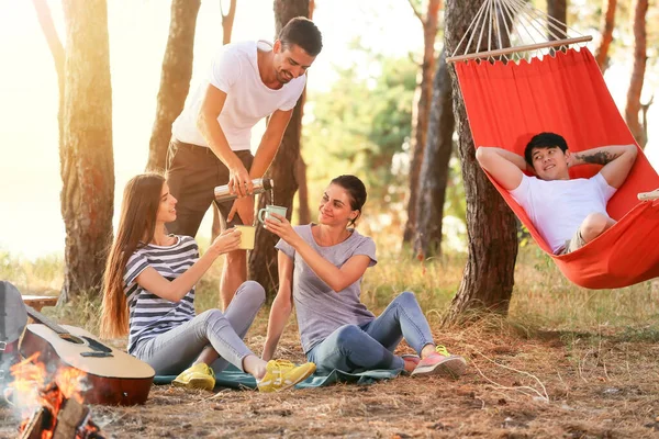 Young friends spending weekend in forest — Stock Photo, Image