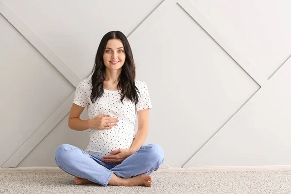 Beautiful young pregnant woman at home — Stock Photo, Image