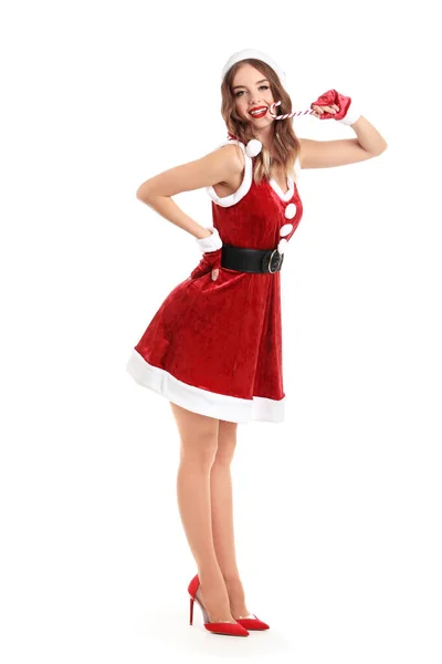 Beautiful woman dressed as Santa with candy cane on white background — Stock Photo, Image