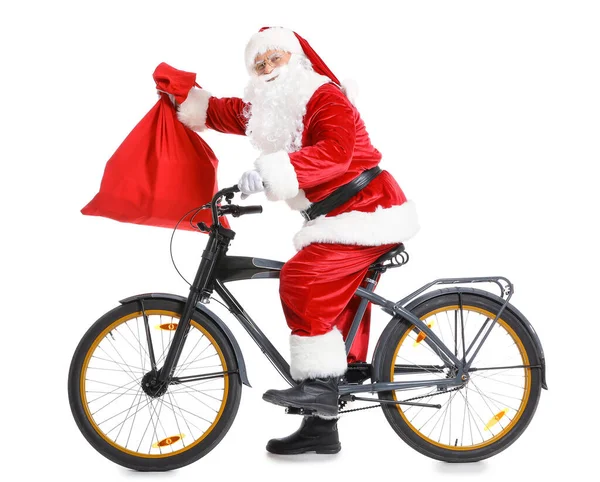 Santa Claus con bolsa y bicicleta sobre fondo blanco — Foto de Stock