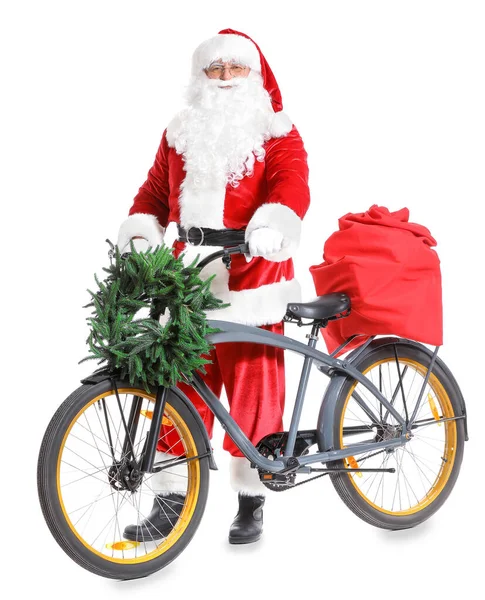 Santa Claus with Christmas gifts and bicycle on white background — Stock Photo, Image