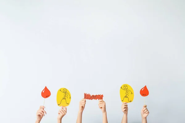 Many hands with Halloween decor on light background — Stock Photo, Image