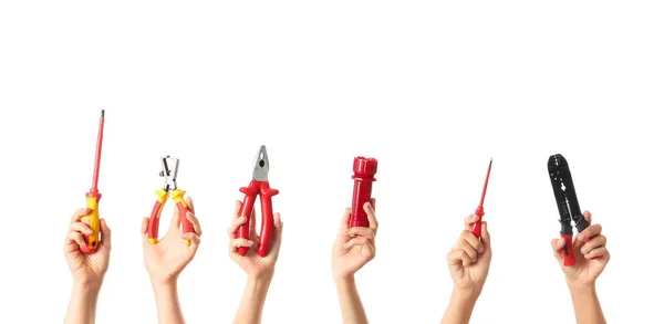 Female hands with electrician's tools on white background — ストック写真