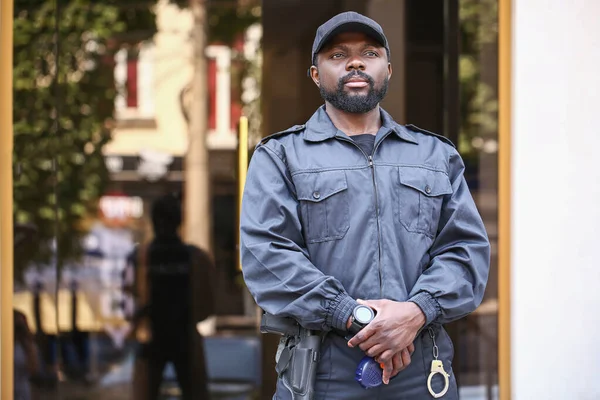 African-American security guard outdoors