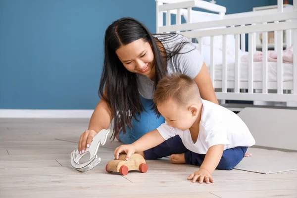 Asian mother and cute little baby playing at home — Stock Photo, Image