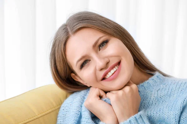 Portrait of beautiful young woman at home — Stock Photo, Image