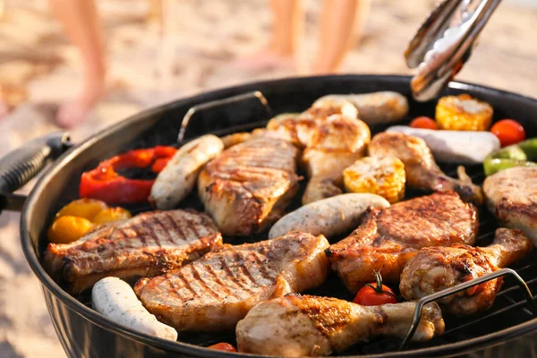 Cooking of tasty food on barbecue grill outdoors, closeup — Stock Photo, Image