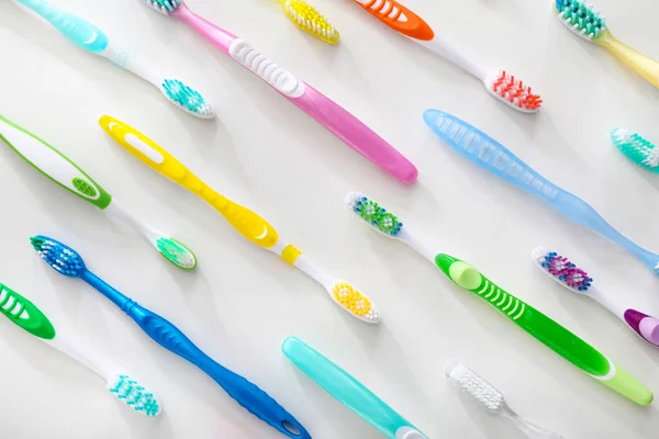 Different tooth brushes on white background — Stock Photo, Image