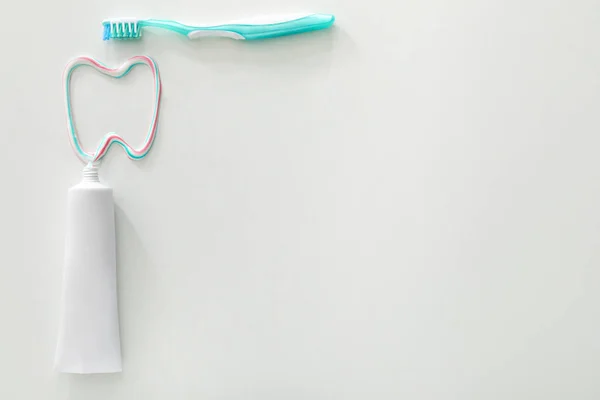 Brush, paste and drawn tooth on white background — Stock Photo, Image