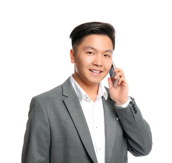 Portrait of Asian businessman talking by mobile phone on white background — Stock Photo, Image