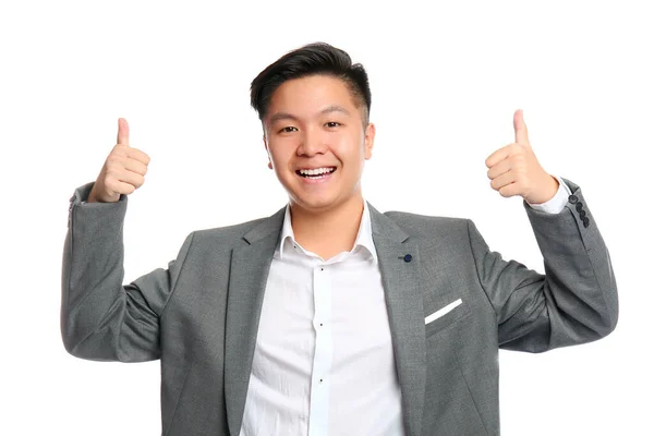 Portrait of Asian businessman showing thumb-up gesture on white background — Stock Photo, Image